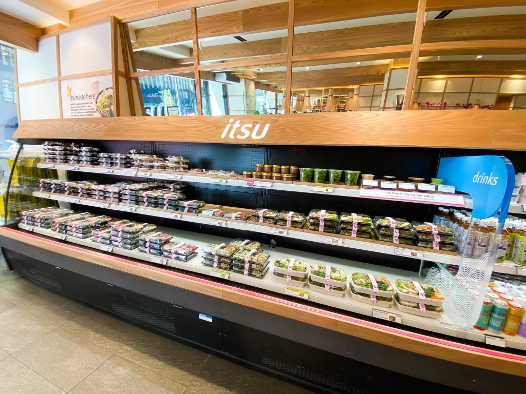 a number of bento boxes neatly lined inside of fast-food store itsu manhattan new york